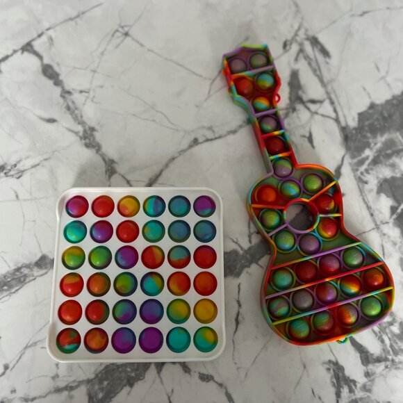 POP ITS Set of 2 Push Dimple Sensory Flipping Board & Guitar Fidget Toys - Picture 1 of 1